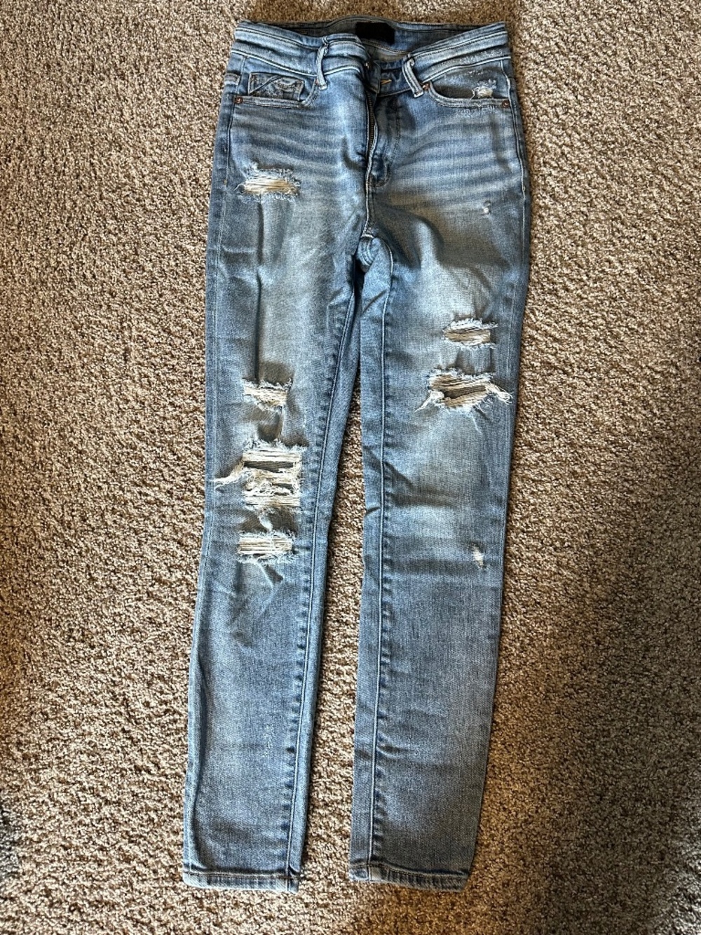 Buckle black distressed skinny jeans 27